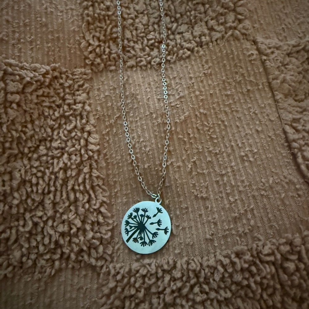 Silver Pendant Necklace with Black Floral Design